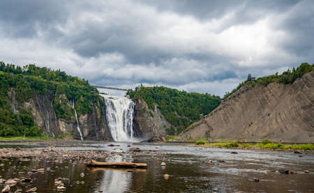 Insane view of Montmorency waterfall from the bottom. Only 10kms away from Quebec City. That waterfall is amazing because superpowerful. Pretty easy to get wet when you admire it from the bottom!の写真素材