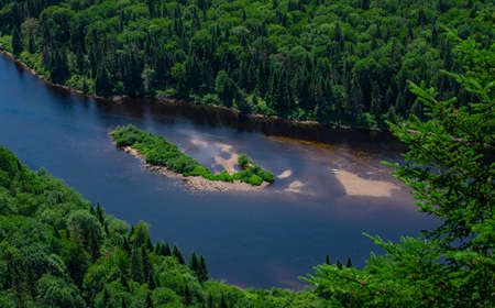 Awesome view from a verdant hill in Jacques Cartier National Park, Quebec province, Canada. Everything is green and mindblowing over here during summerの写真素材