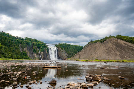 Insane view of Montmorency waterfall from the bottom. Only 10kms away from Quebec City. That waterfall is amazing because superpowerful. Pretty easy to get wet when you admire it from the bottom!の写真素材