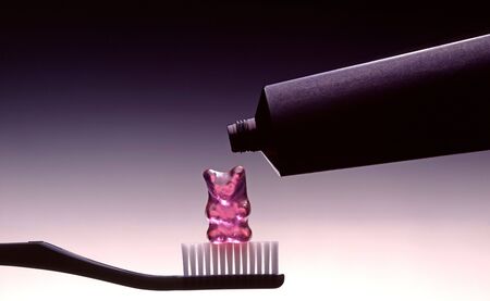 Toothbrush and toothpaste symbolized the ravages of the sugarの写真素材