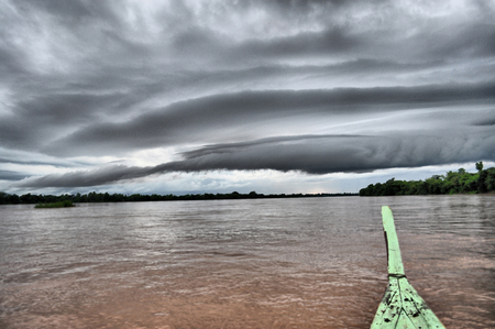 Monsoon clouds on the river Mekong in Laosの写真素材