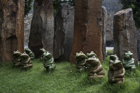 Frogs statues and stone pillars in a Vietnamese park.の写真素材