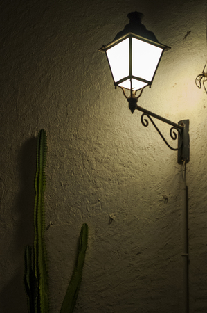 Dark lights in a street of Cadaques, a town in northern Spainの写真素材