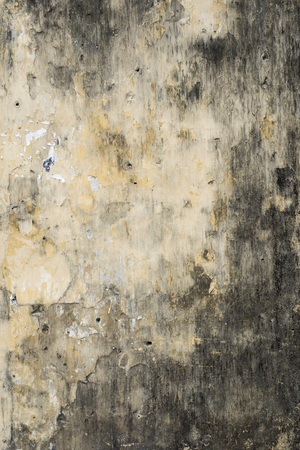 Old painted wall of a French colonial house in Hoi An, Vietnamの写真素材