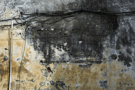Old painted wall of a French colonial house in Hoi An, Vietnamの写真素材
