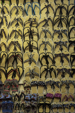 Background of sandals from a street stall at night in Vietnamの写真素材