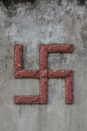 Large red swastika on a temple's wall in Ho Chi Minh City, Vietnamの写真素材