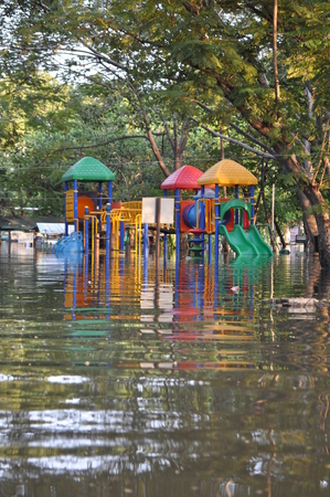 Kids park is underwater in a flooded street of Bangkok, Thailand, on the 06 November 2011のeditorial素材