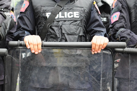 Bangkok/Thailand - 11 24 2012: Riot police face protesters at Royal Plaza.のeditorial素材