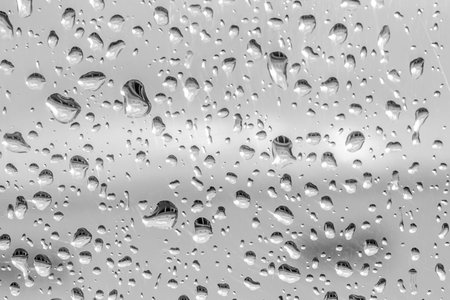 Water drops on translucent glass.