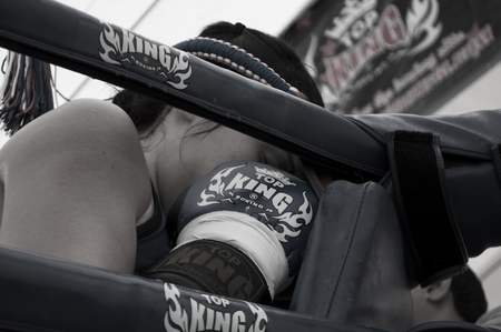 Muay Thai boxer during the pre-fight traditional round at the 9th World Thai Martial Arts Festival in Ayutthaya, Thailand.のeditorial素材