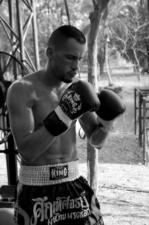 Muay Thai boxer from the French team gets ready before a fight at the 9th World Thai Martial Arts Festival in Ayutthaya, Thailand.のeditorial素材