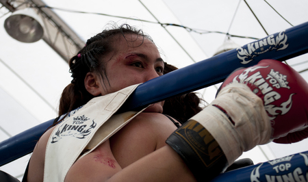Muay Thai boxers during a fight at the 9th World Thai Martial Arts Festival in Ayutthaya, Thailand.のeditorial素材