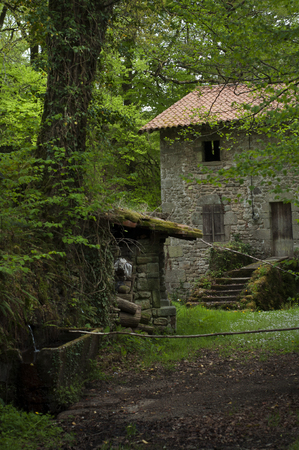 Old French mill house in the forestの写真素材