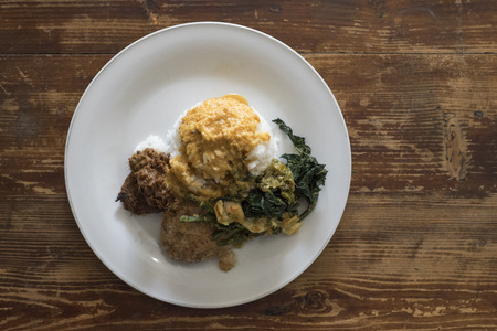 Top view of Indonesian dish on a wooden table.の写真素材
