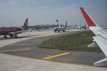 Planes are queuing on the tarmac before take off at Ho Chi Minh City airport, Vietnam.のeditorial素材