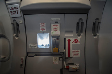Emergency exit inside a plane of a Vietnamese companyのeditorial素材