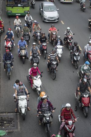 Vietnamese bike riders commute in a jammed street of Ho Chi Minh Cityのeditorial素材
