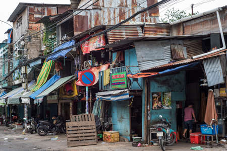 Locals have a quiet time in a poor street of Ho Chi Minh City, Vietnamのeditorial素材