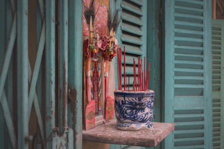 Detail of a houseâ€™s facade at Hao Si Phuong old traditional alley in Ho Chi Minh City,...