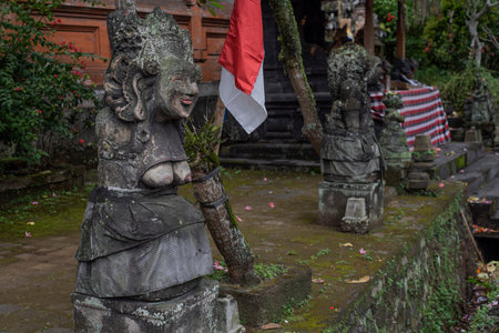 Balinese Hindu statue in front of a temple in Bali, Indonesia.