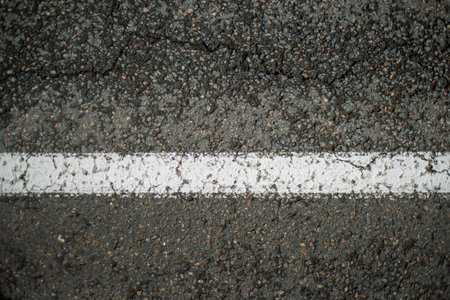 Asphalt texture with white line on the road. Abstract background.