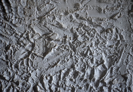 Background close up of a plastered wall of a traditional French house.