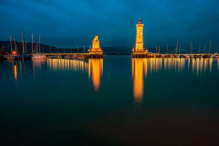 View of the harbor entrance and lighthouse in Lindau on Lake Constance.のeditorial素材
