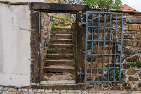 Old metal door and stairs to the parkの写真素材