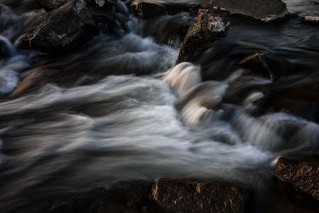 Waterfall at sunset, long exposure.の写真素材