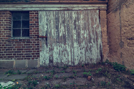 Abandoned house with old wooden gateの写真素材