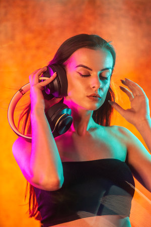 Portrait shot of a pretty young woman in RGB colors.の写真素材