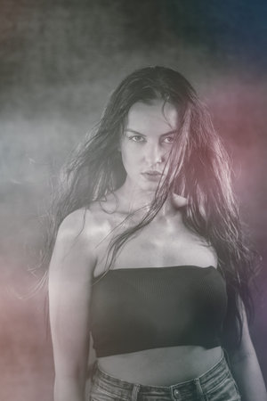 Portrait shot of a pretty young woman in RGB colors. Surreal blurry portraitの写真素材