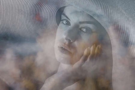 Portrait shot of a pretty young woman. Surreal blurry portraitの写真素材