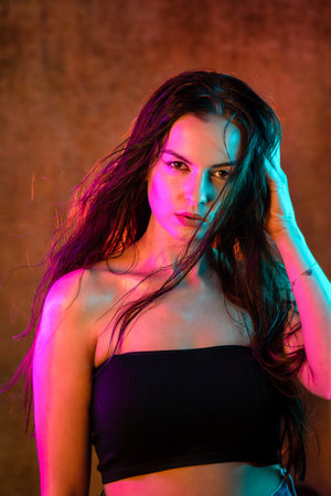 Portrait shot of a pretty young woman in RGB colors.