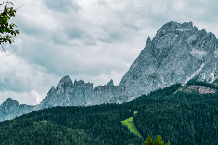 panoramic view of the forests and mountains of the Dolomites, Italy.