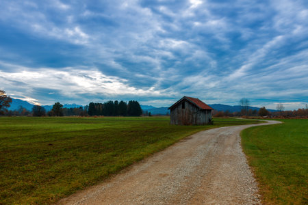 landscape with country road and blue skyの写真素材
