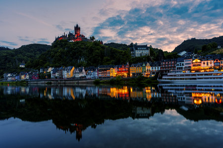 Moselle with city lights from Cochem at night, Germany. Imperial Castle of Cochem.