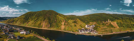 Panoramic view of the Moselle vineyards near Beilstein, Germany. Metternich Castle above the Moselle river. Drone photography.のeditorial素材