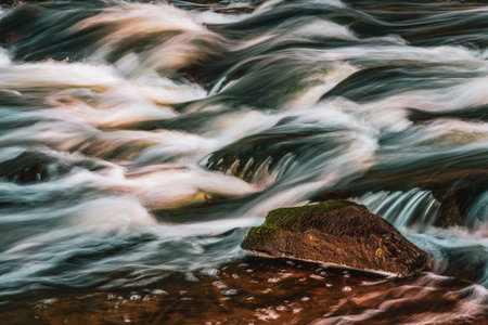 Colorful flowing water. Long exposure of flowing water.