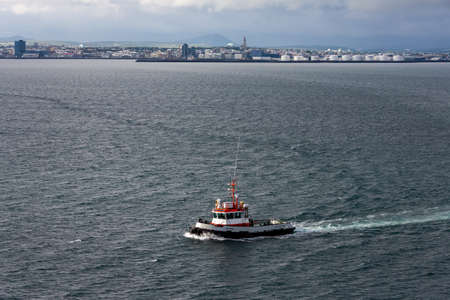 A fishing boat off the coast of Iceland.の写真素材
