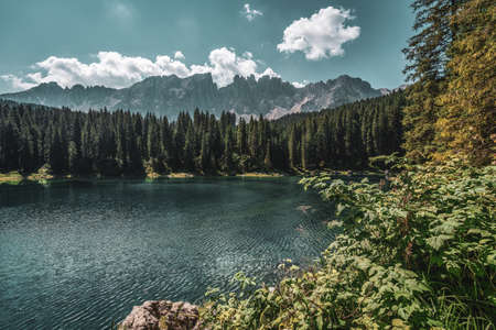 Lake Carezza, view on the lake with the Latemar range in the background. Italy.の写真素材