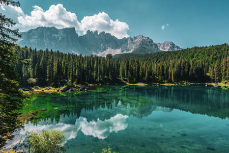 Lake Carezza, view on the lake with the Latemar range in the background. Italy.の写真素材
