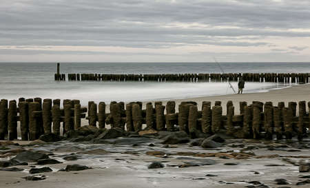 Fishing on the North Sea beach.の写真素材