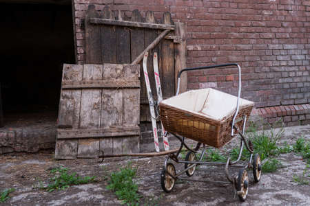 Old antique baby carriage. Lost Places.の写真素材