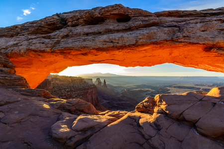 Sunrise lighting up the underside of Mesa Arch in Canyonlands National Park, Moab, UTの写真素材