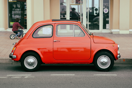 Menton, France - May 14, 2016: Small Italian car Fiat 500 Parked in a Parking Lot in Menton. Red Fiat 500 Rのeditorial素材