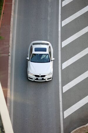 Monte-Carlo, Monaco - September 30 2018 : Aerial View Of A Beautiful White BMW (Top View) Driving On The Boulevard Du Larvotto In Monaco, French Rivieraのeditorial素材