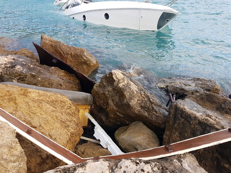 Close Up View Of Luxury Yacht Half Sunken After Storm In The Mediterranean Sea, France, Europeの写真素材
