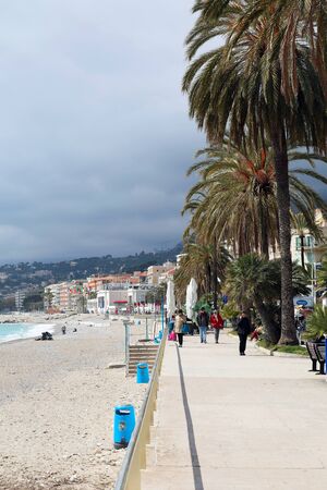 Menton, France - April 5, 2018: Beautiful View Of The Seaside Town Of Menton, Palm Trees, Buildings, The Beach And The Mediterranean Sea, French riviera, Europeのeditorial素材